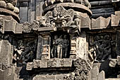 Prambanan - Candi Lara Jonggrang, miniature shrines surmounted by small fluted stupa with panels with musicians and dancers decorating the top of the balustrade 